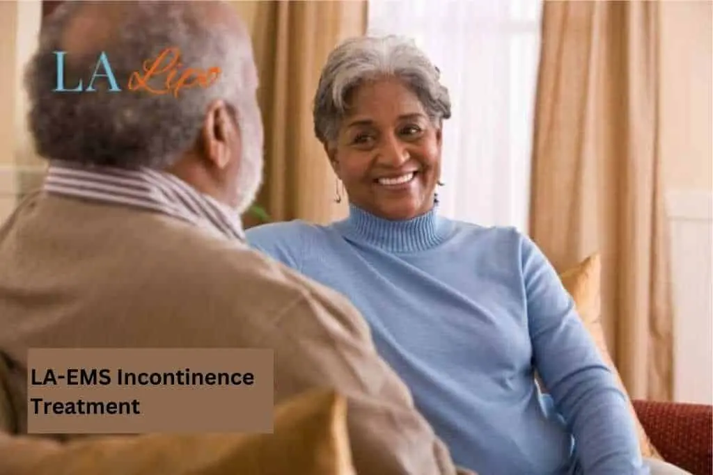 Couple sat smiling at each other - LA-EMS treatment Holmes Chapel