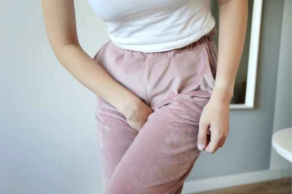 woman struggling with urine incontinence Holmes Chapel